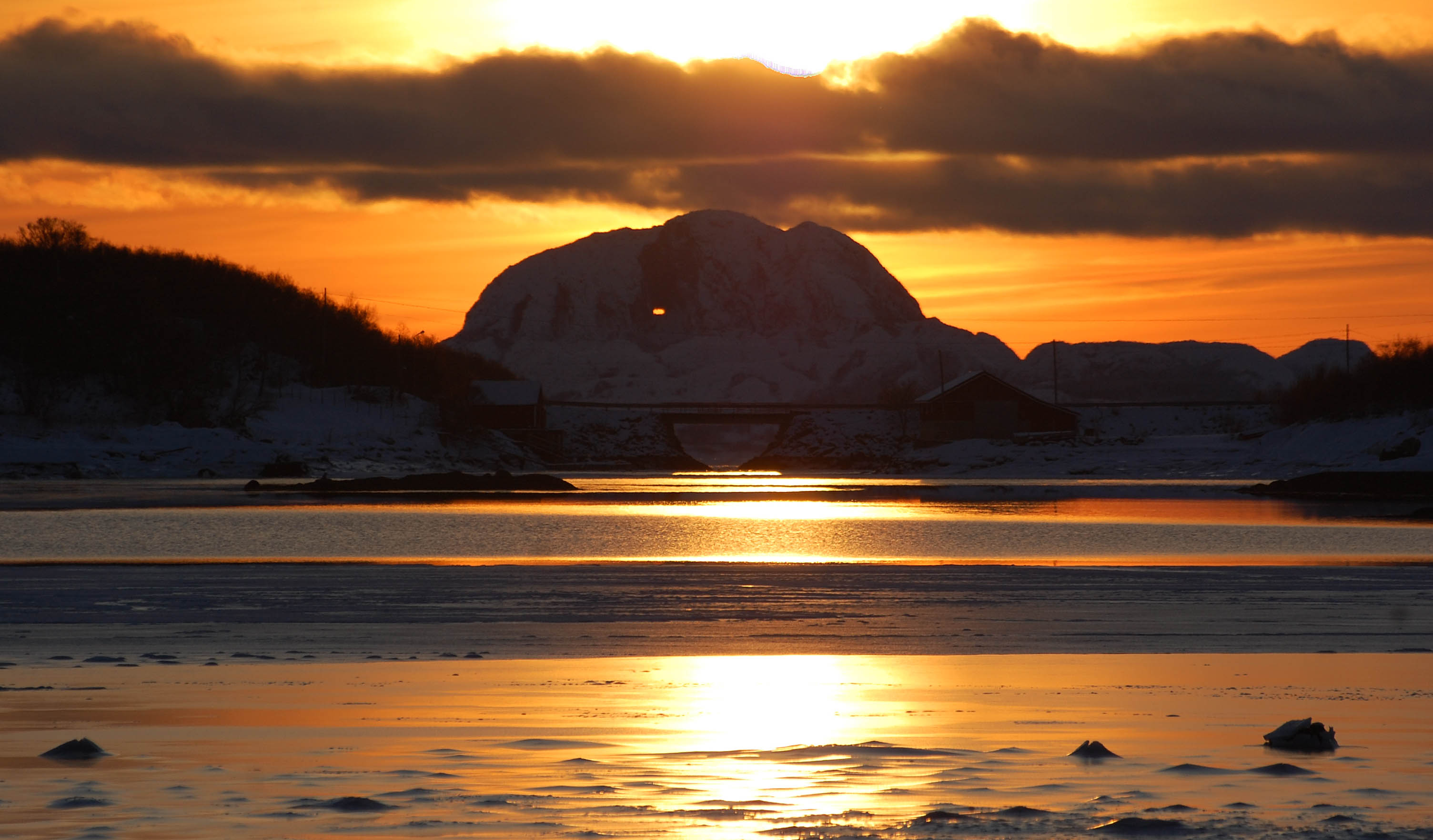 The mountain Torghatten at sunset in wintertime.