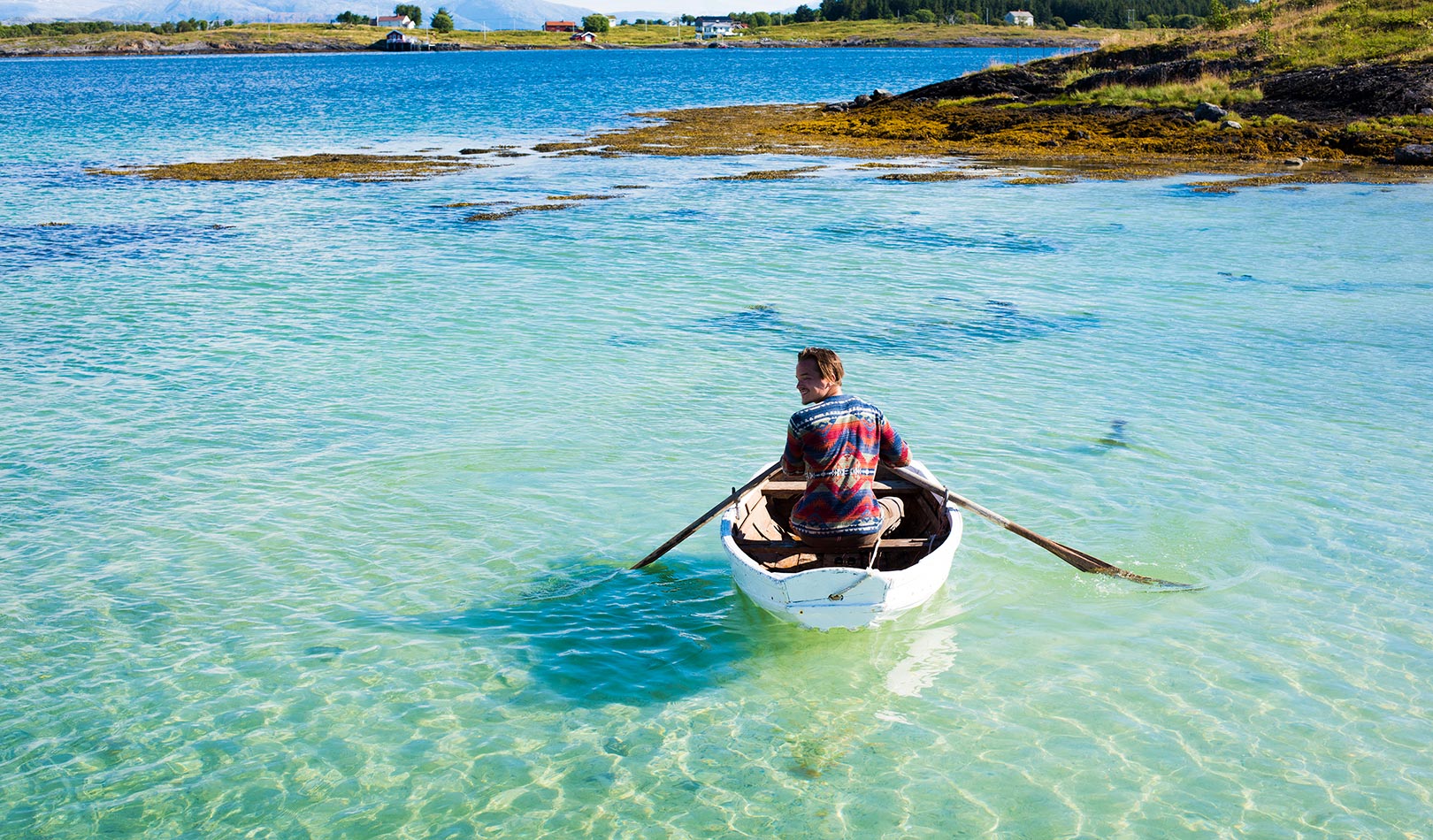 Boat rowing on the coast of Herøy, Helgelandskysten.