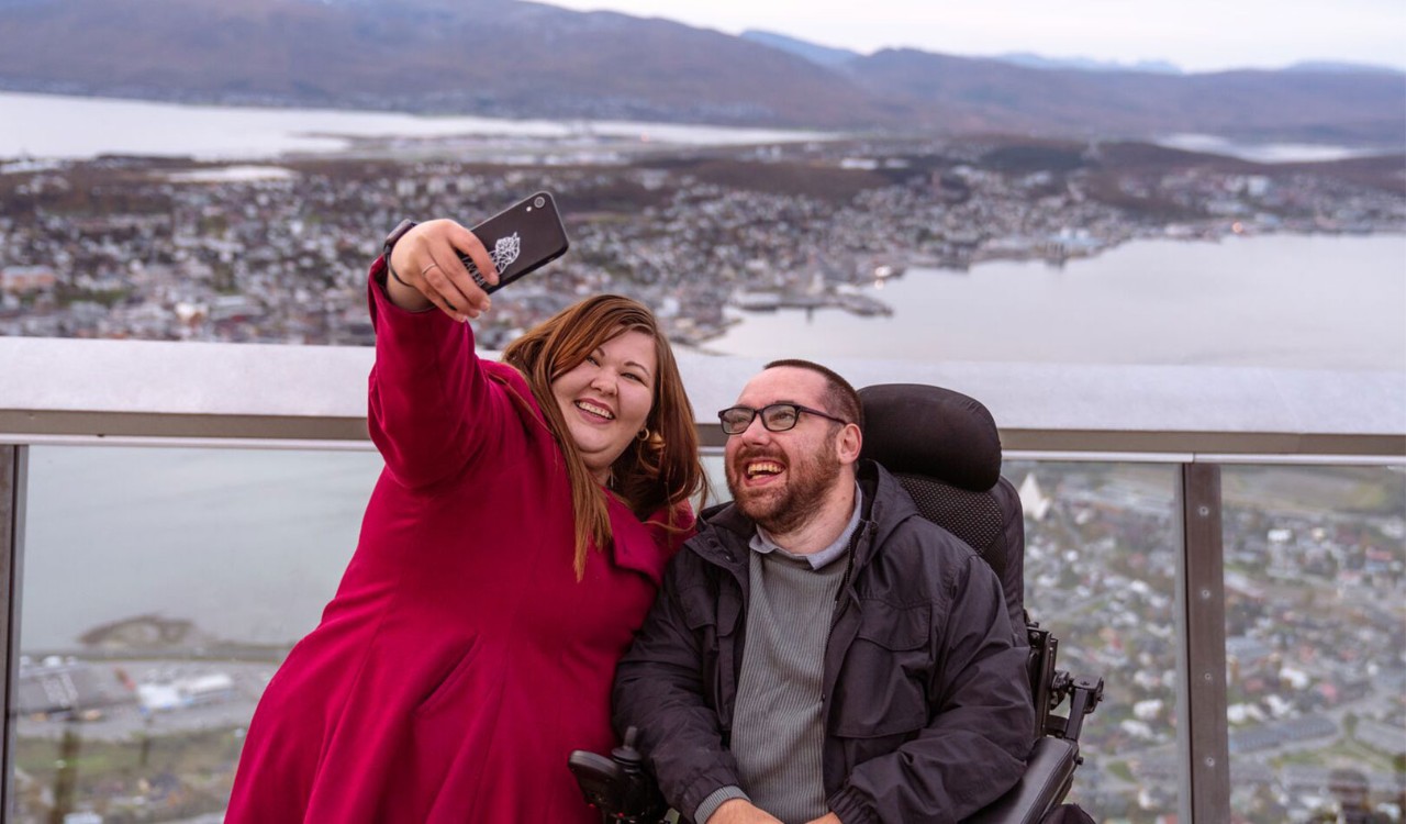 Couple taking a selfie from Fjellheisen in Tromsø